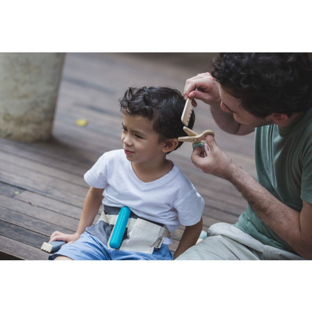 Kid playing PlanToys Hair Dresser Set