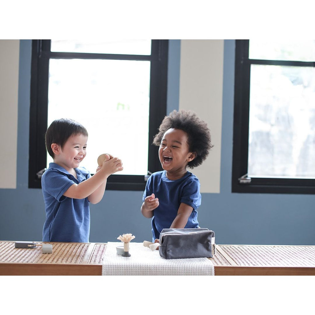 Kid playing PlanToys Shave Set