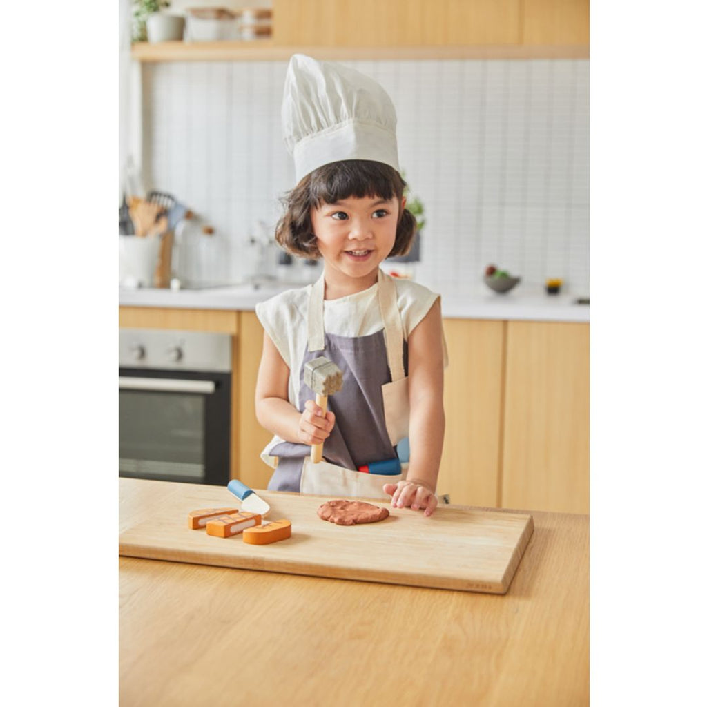 Kid playing PlanToys Chef Set