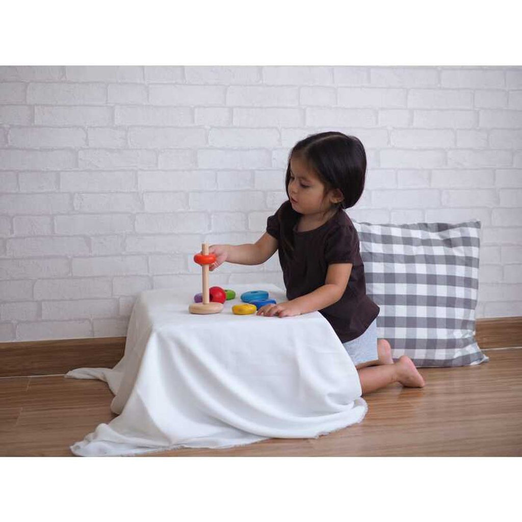 Kid playing PlanToys Stacking Ring