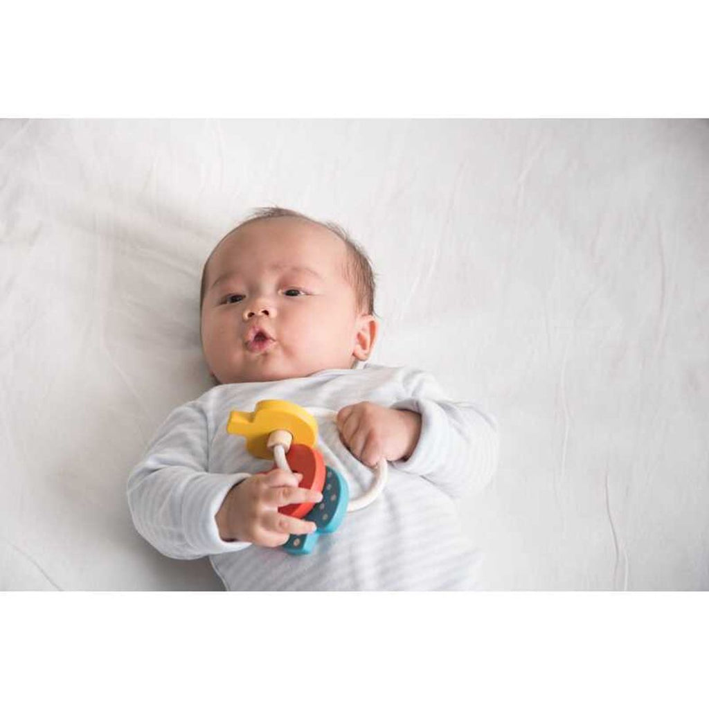 Kid playing PlanToys Baby Key Rattle