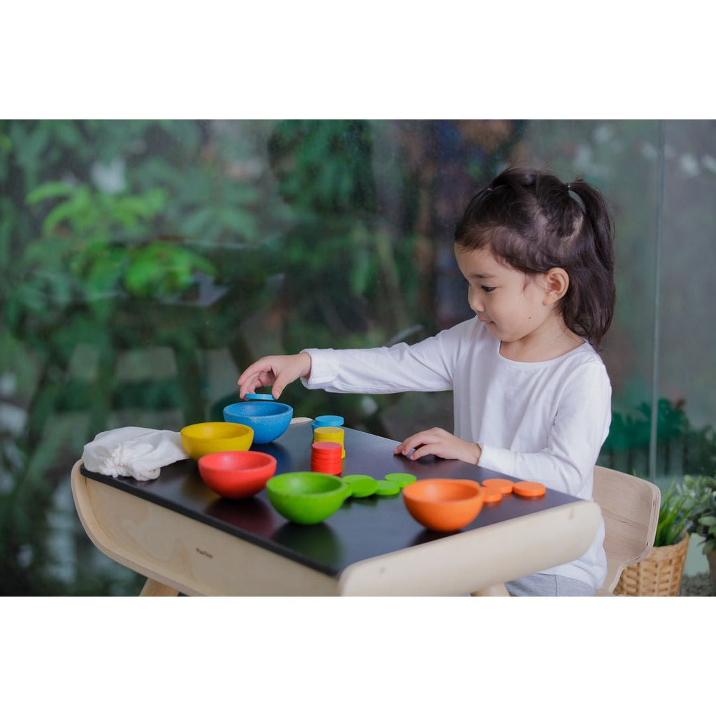 Kid playing PlanToys Sort & Count Cups