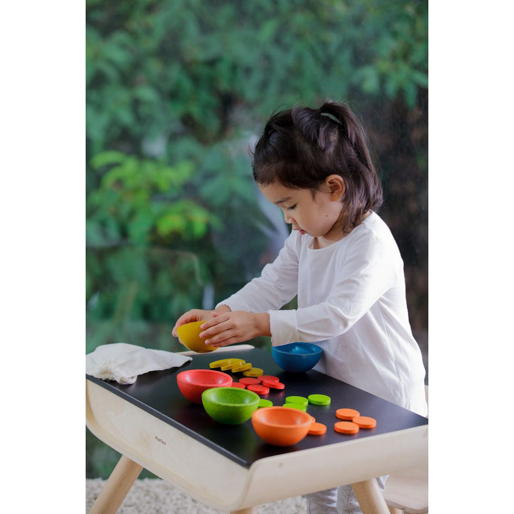 Kid playing PlanToys Sort & Count Cups