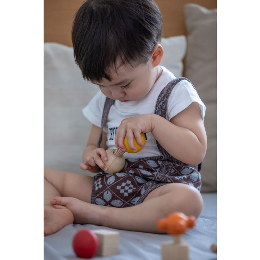 Kid playing PlanToys Nuts & Bolts