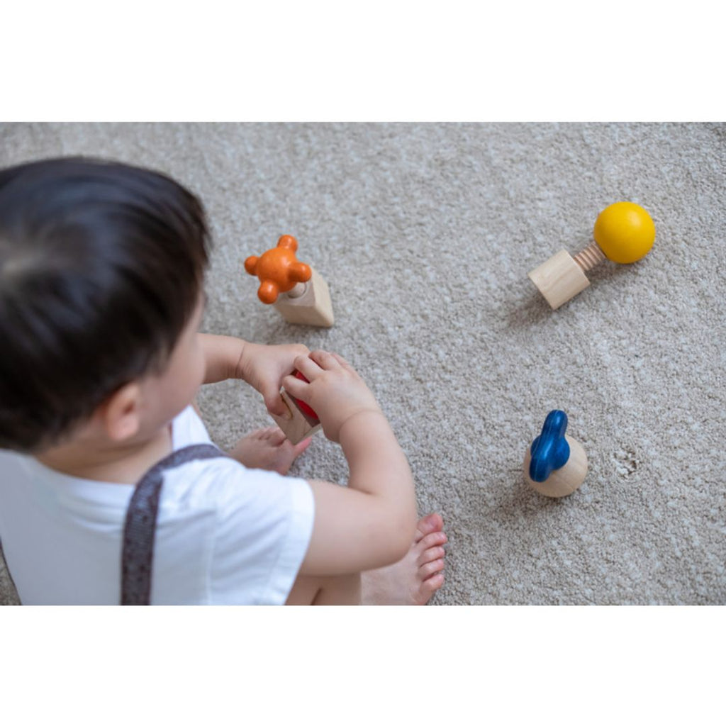 Kid playing PlanToys Nuts & Bolts