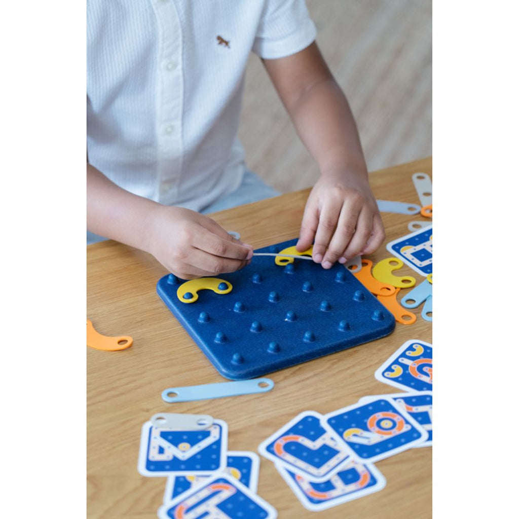 Kid playing PlanToys Creative Board