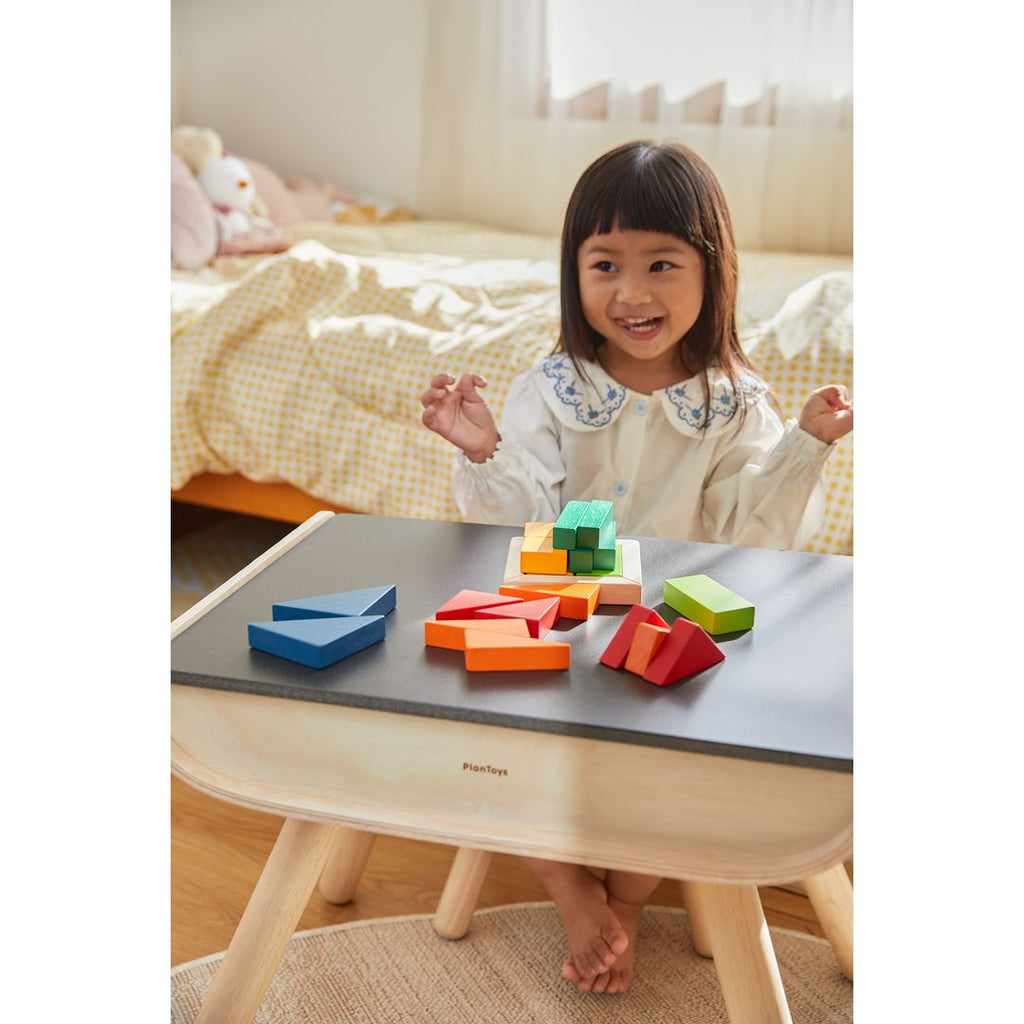 Kid playing PlanToys Fraction Blocks - Unit Plus