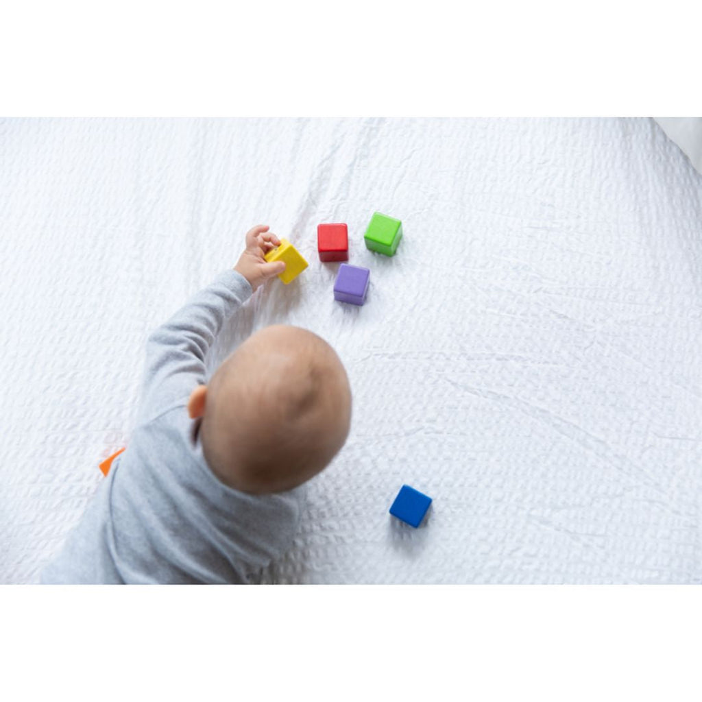 Kid playing PlanToys Activity Blocks