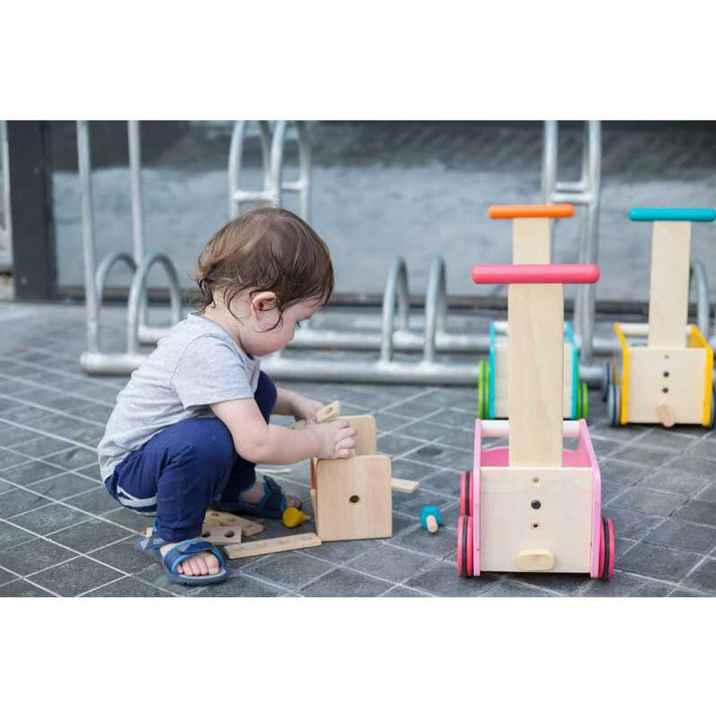 Kid playing PlanToys Robot Toolbox