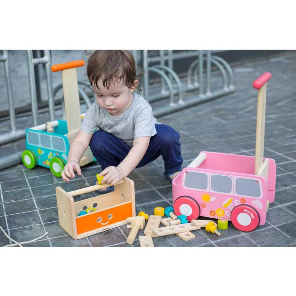 Kid playing PlanToys Robot Toolbox