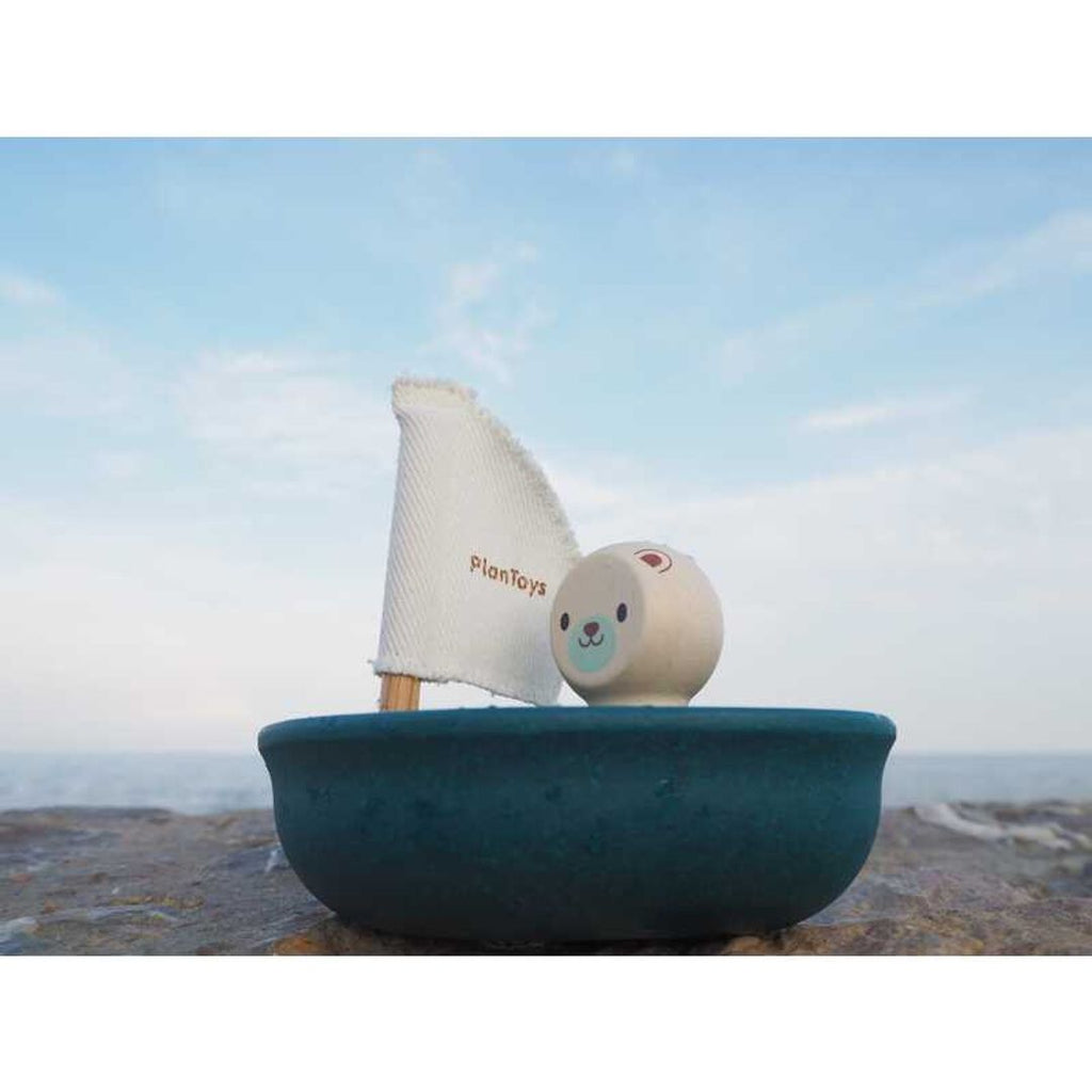 Kid playing PlanToys Sailing Boat - Polar Bear