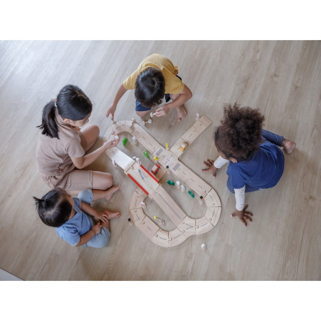 Kid playing PlanToys Rubber Road & Rail Set - Medium