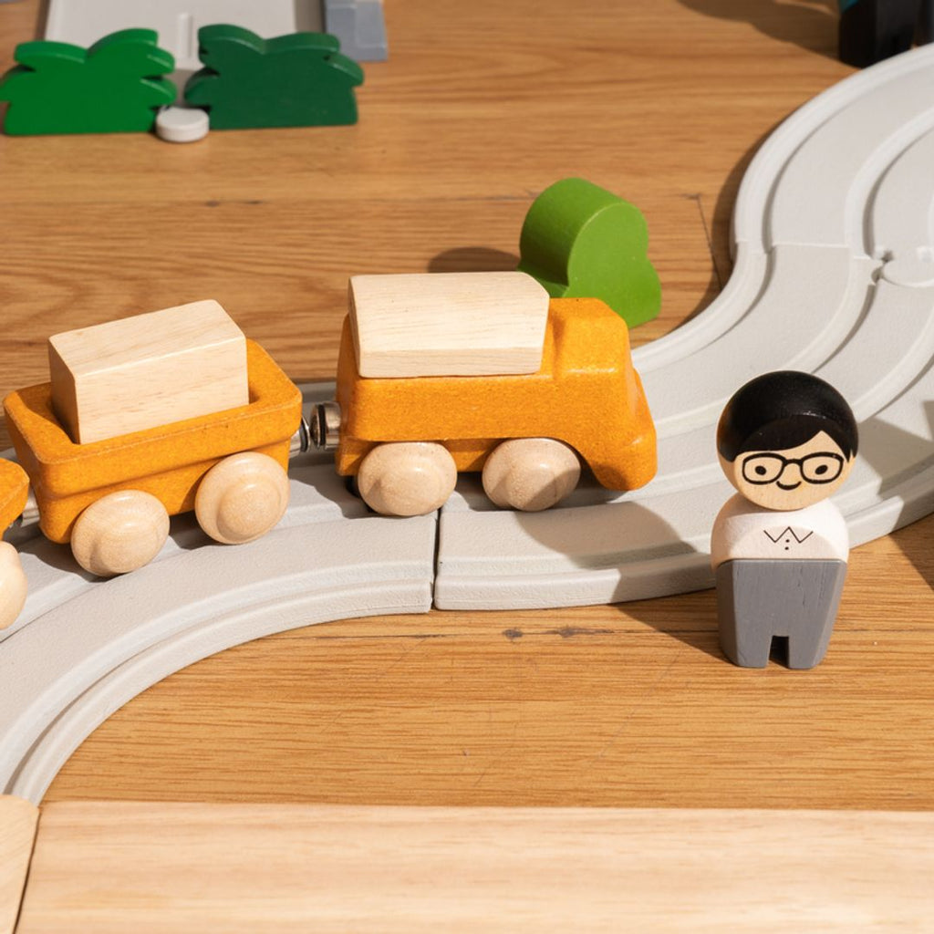 Kid playing PlanToys Cargo Train