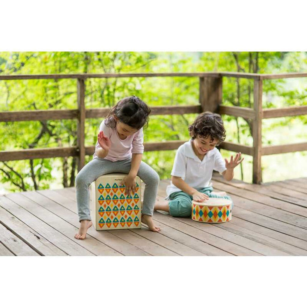 Kid playing PlanToys Rhythm Box II